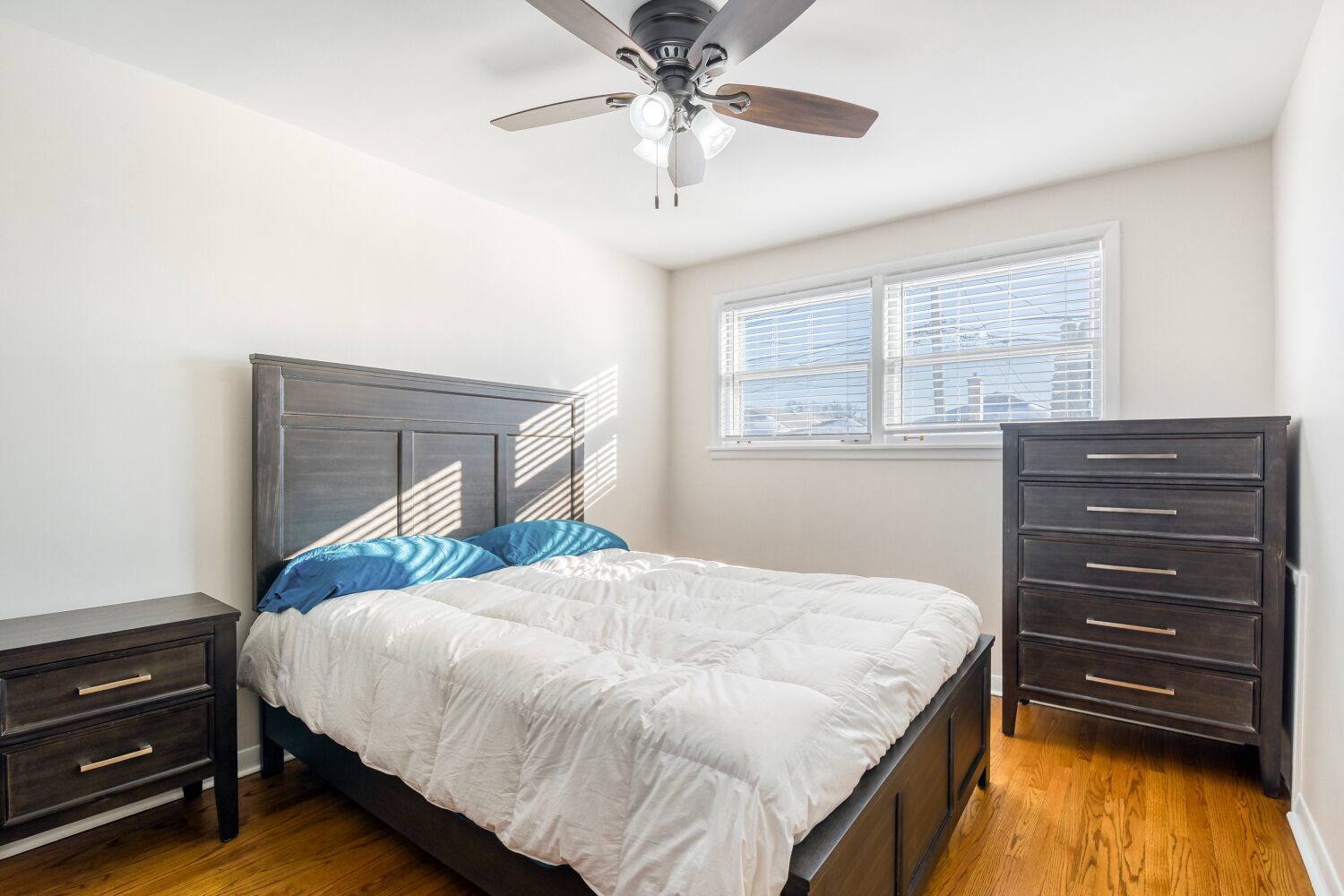 3643 West 113th Street Chicago, IL 60655 - Photo 12 of 19 a bedroom with a bed and a chandelier