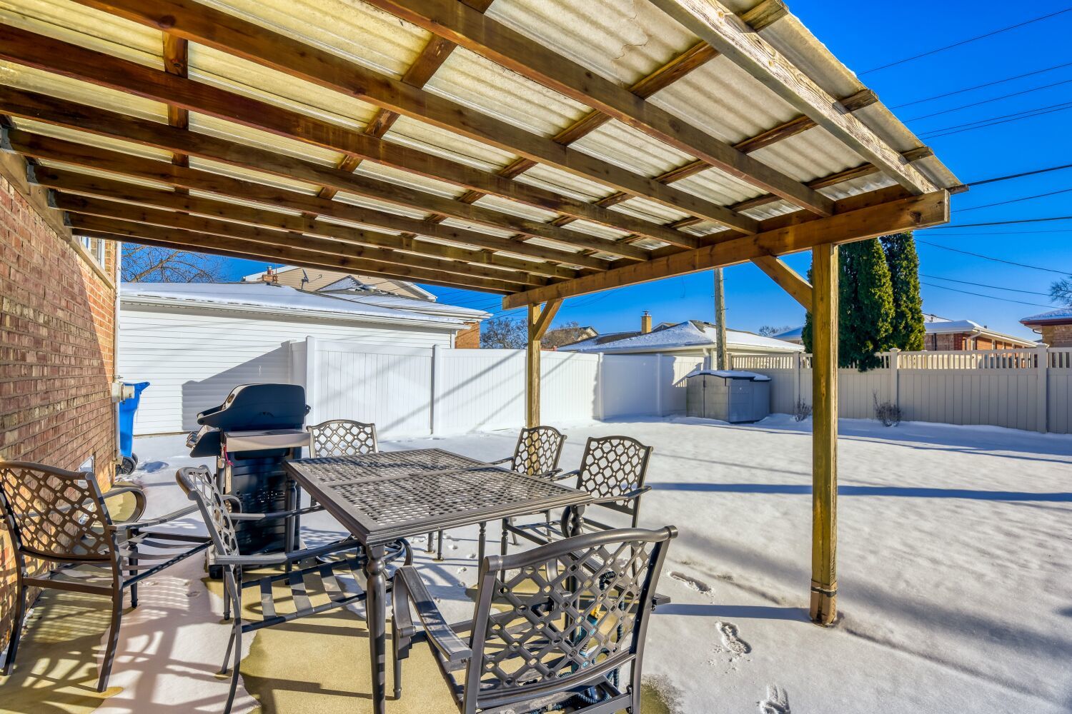 3643 West 113th Street Chicago, IL 60655 - Photo 16 of 19 a patio with table and chairs and potted plants