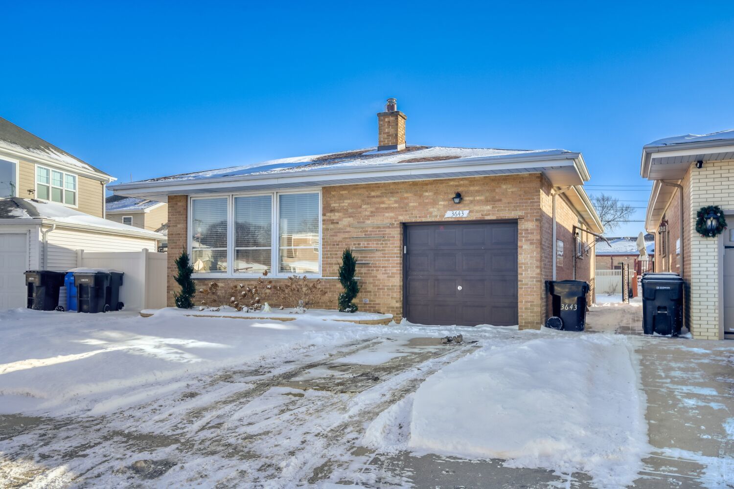 3643 West 113th Street Chicago, IL 60655 - Photo 2 of 19 a front view of a house with a yard and garage