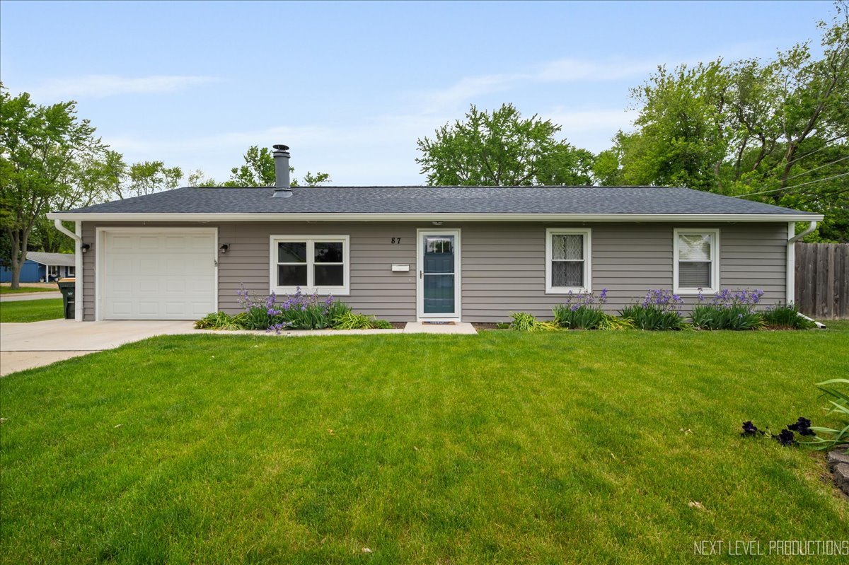 87 Saugatuck Road Montgomery, IL 60538 - Photo 1 of 27 a front view of house with yard and green space