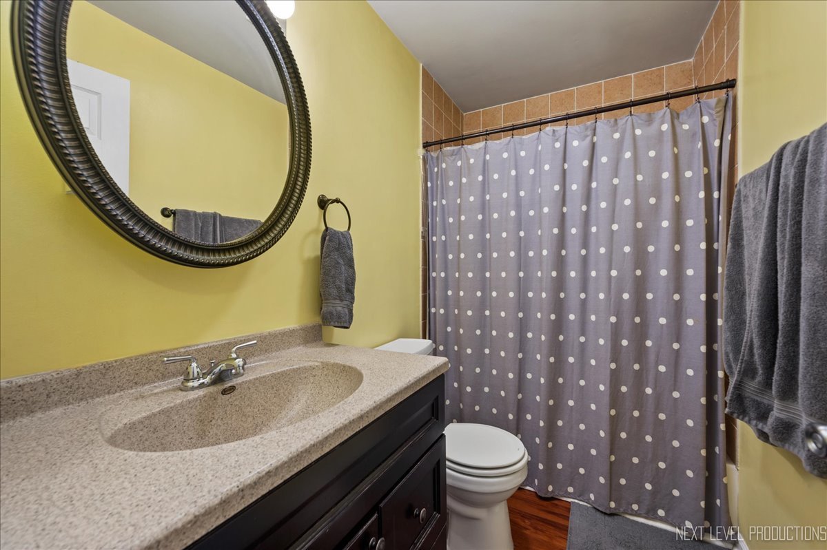 87 Saugatuck Road Montgomery, IL 60538 - Photo 12 of 27 a bathroom with a granite countertop sink and a mirror