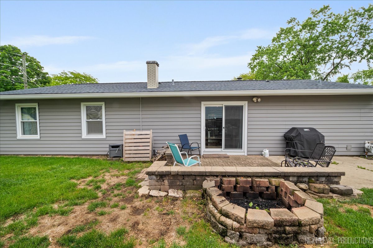 87 Saugatuck Road Montgomery, IL 60538 - Photo 23 of 27 a view of house with backyard outdoor seating area and green space