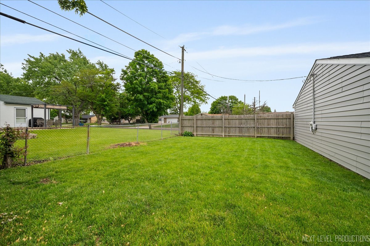87 Saugatuck Road Montgomery, IL 60538 - Photo 26 of 27 a view of a field with grass