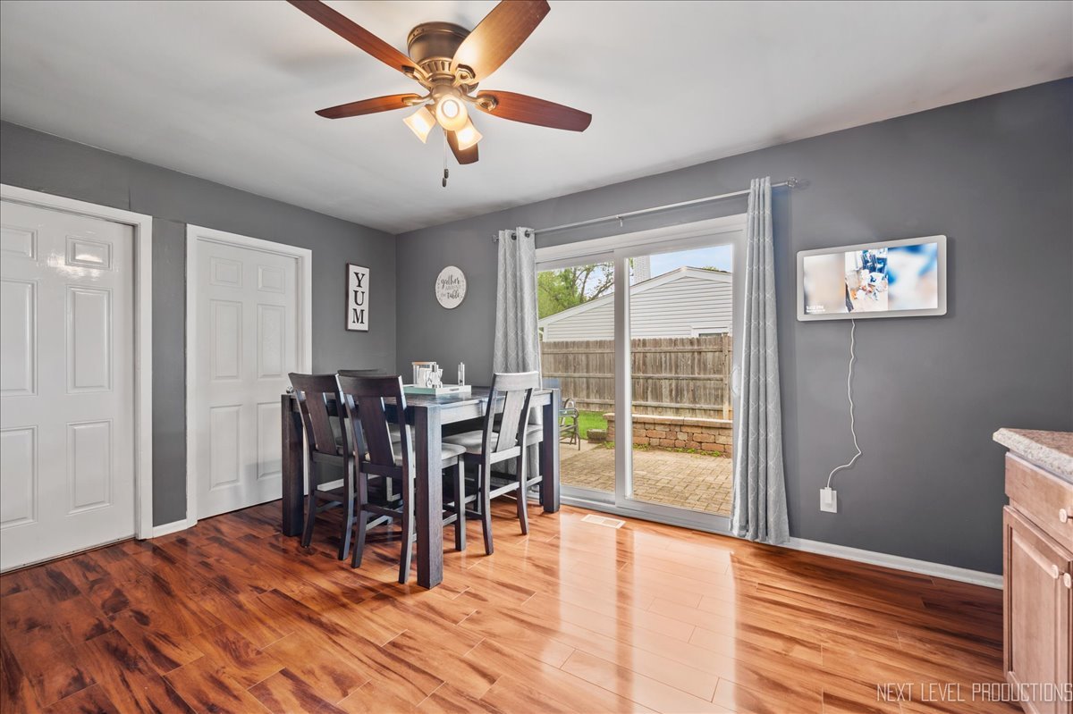 87 Saugatuck Road Montgomery, IL 60538 - Photo 8 of 27 a view of a dining room with furniture window and wooden floor
