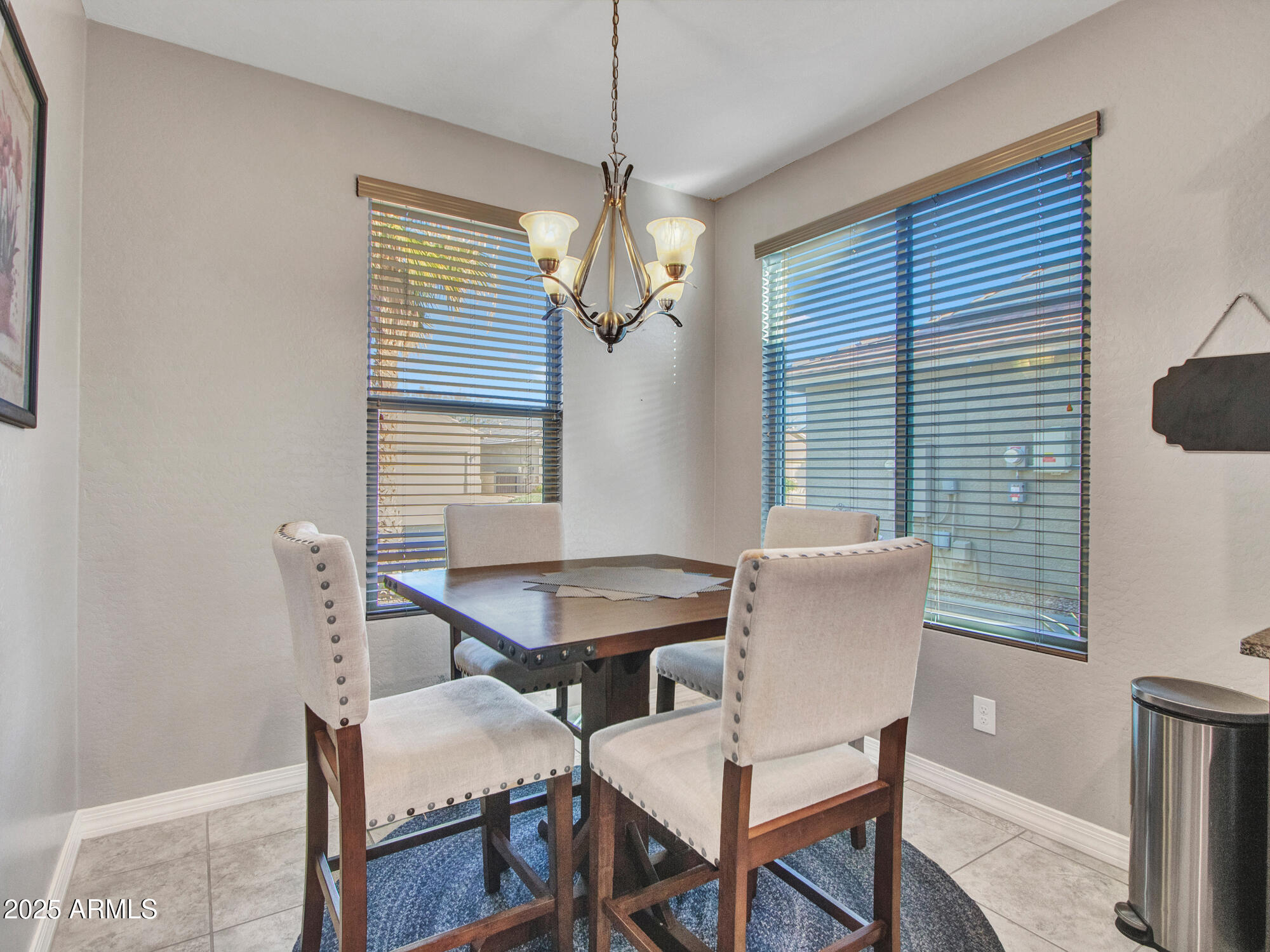22585 West Moonlight Path Buckeye, AZ 85326 - Photo 15 of 35 a view of a dining room with furniture and window