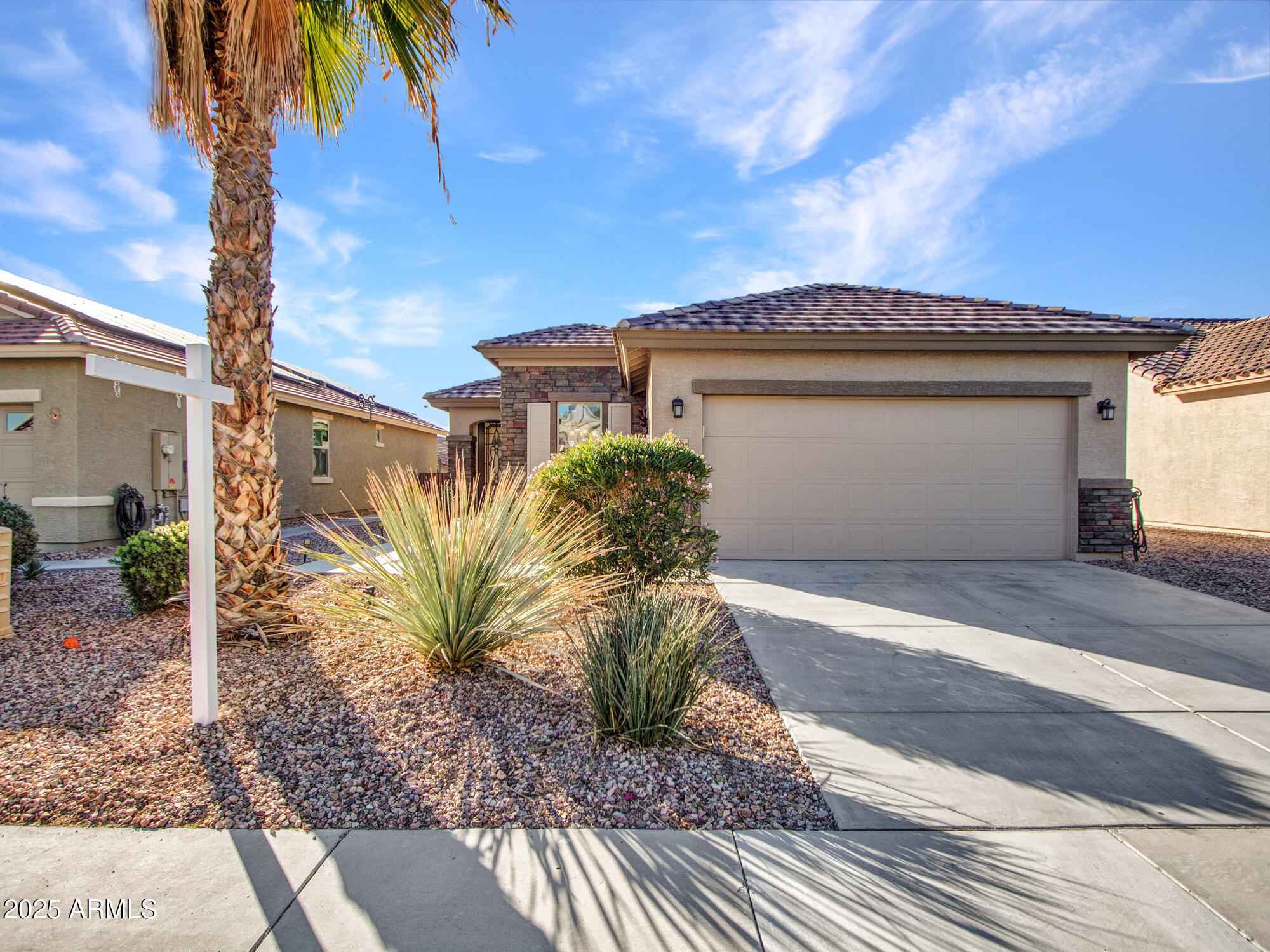 22585 West Moonlight Path Buckeye, AZ 85326 - Photo 2 of 35 a view of a house with a yard