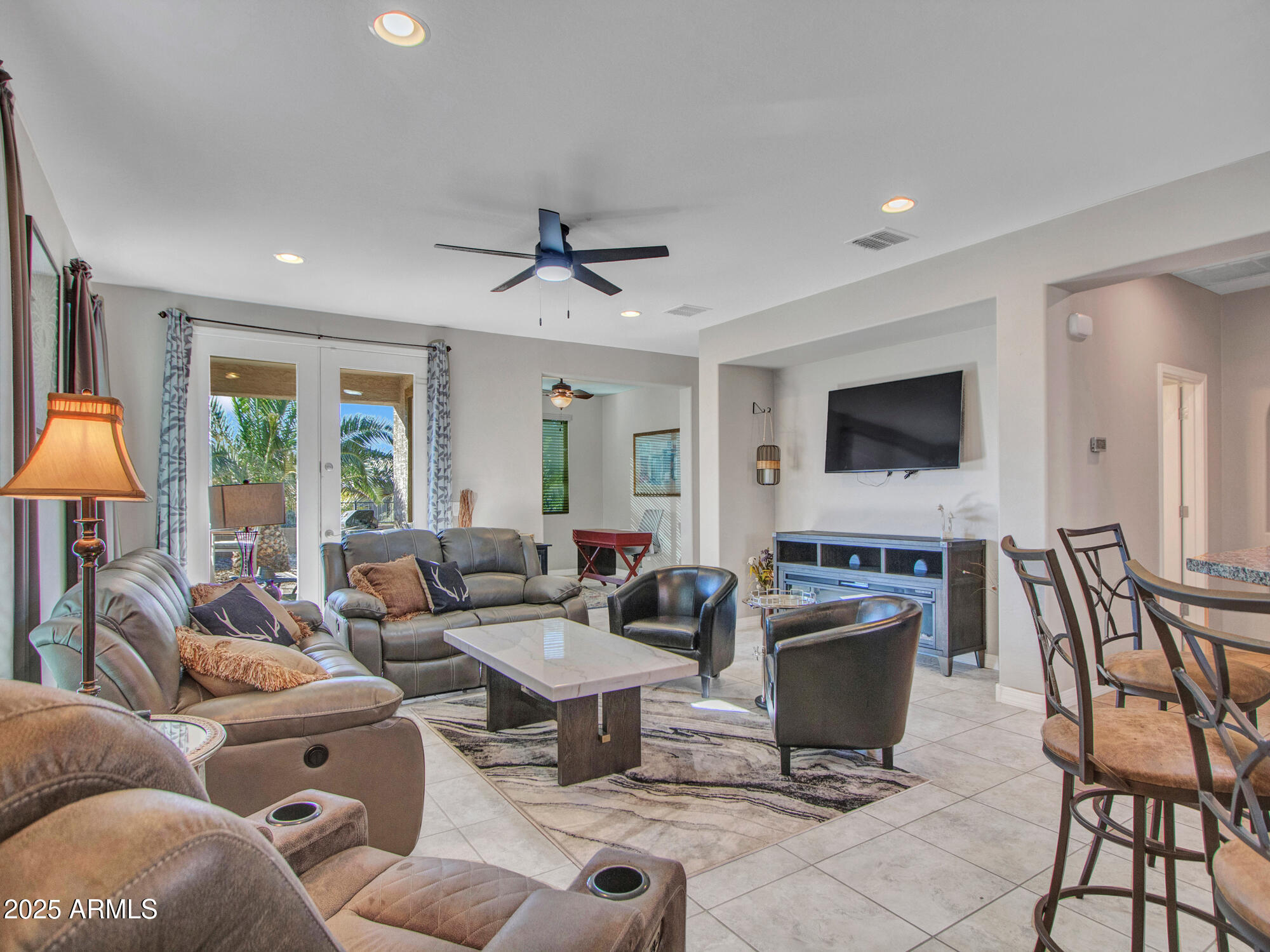 22585 West Moonlight Path Buckeye, AZ 85326 - Photo 6 of 35 a living room with furniture and a flat screen tv