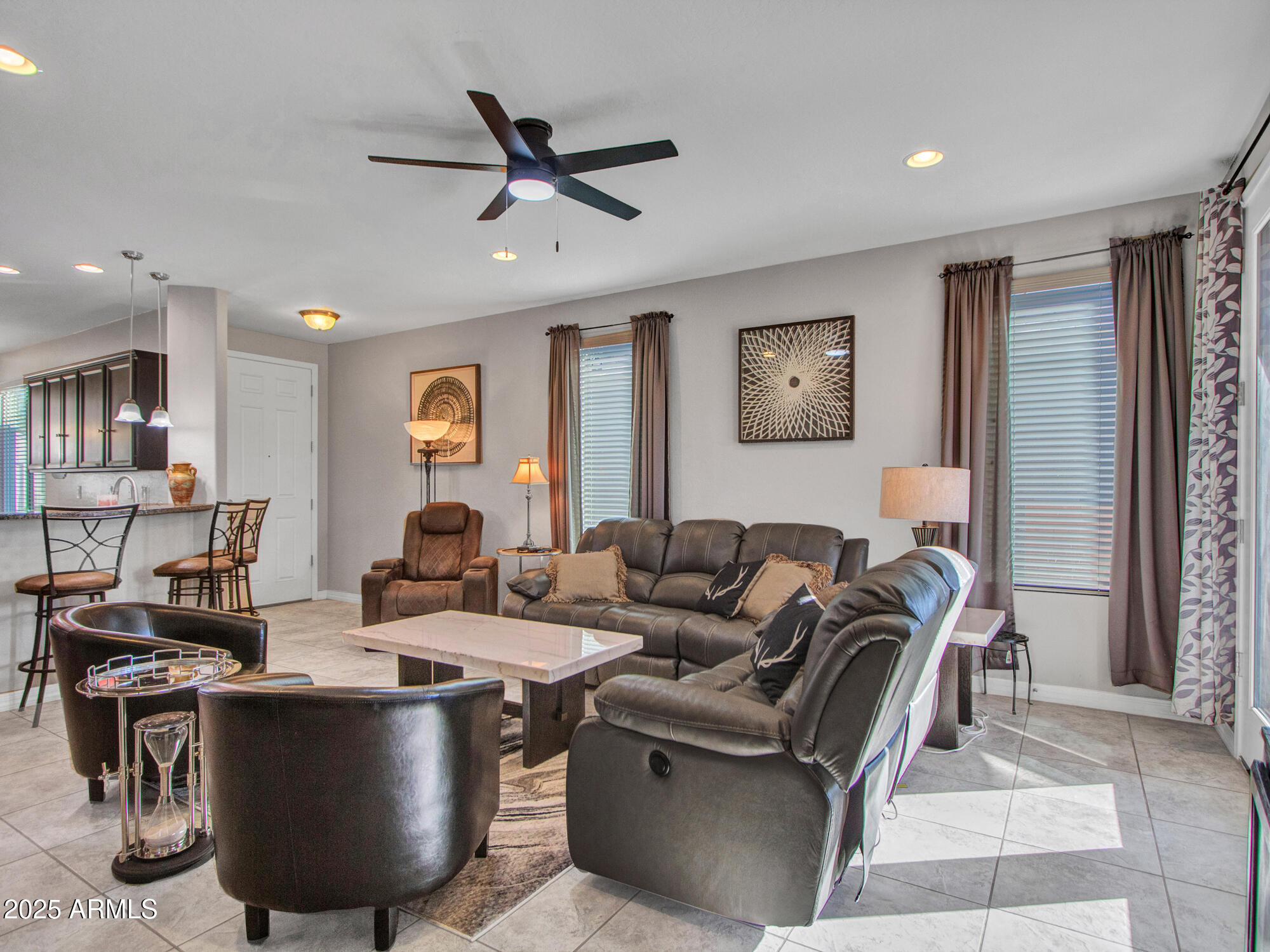 22585 West Moonlight Path Buckeye, AZ 85326 - Photo 8 of 35 a living room with furniture and a window