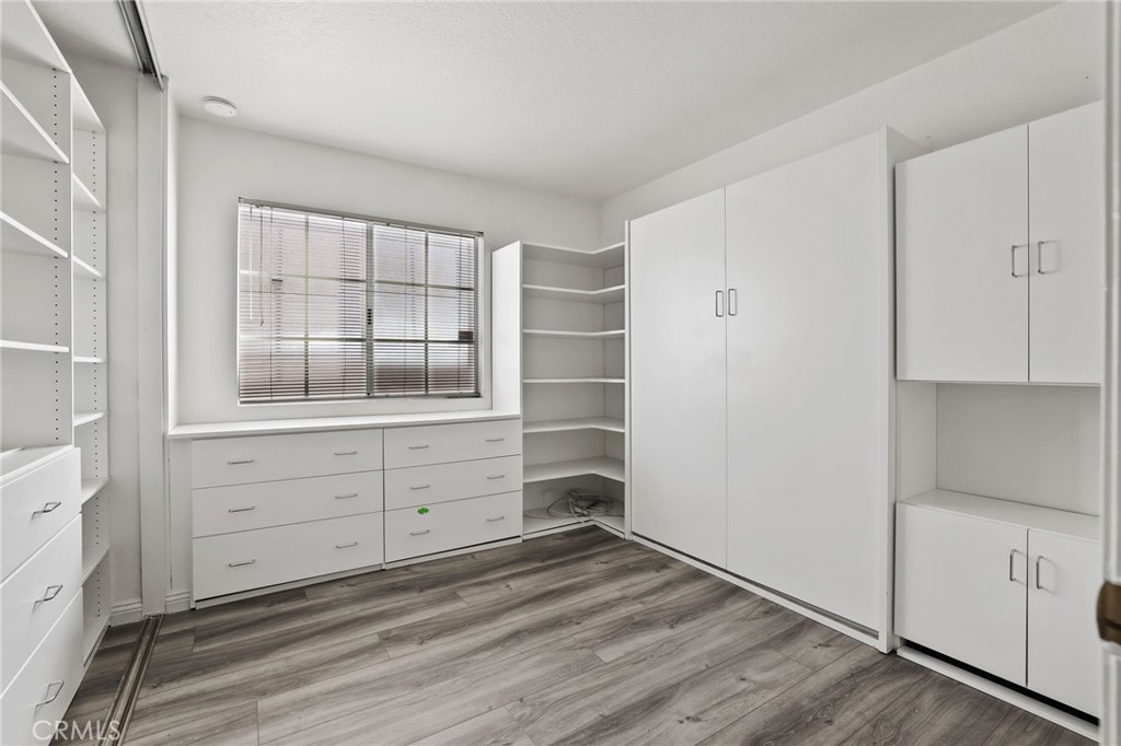 4 Gettysburg Irvine, CA 92620 - Photo 22 of 48 a room with cabinet and wooden floor