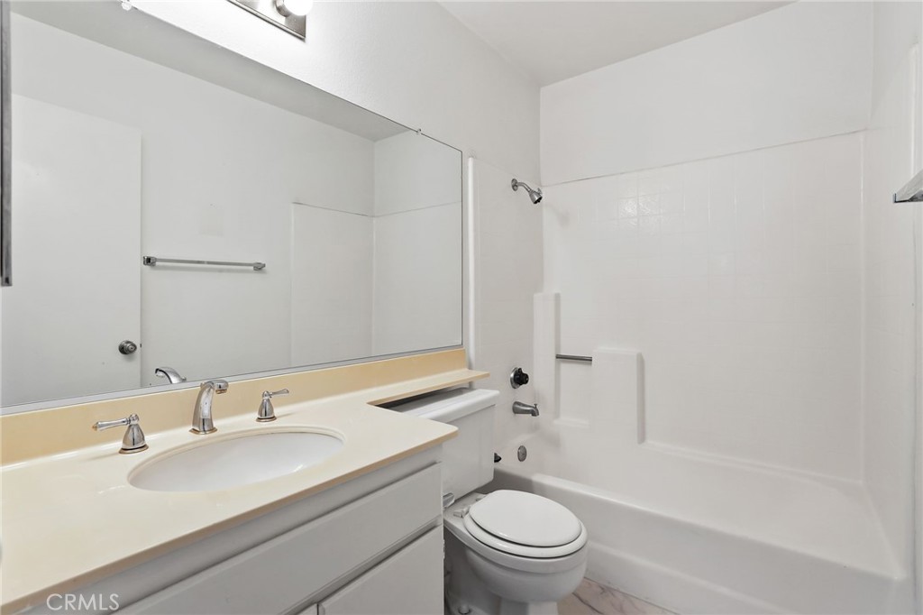 4 Gettysburg Irvine, CA 92620 - Photo 26 of 48 a bathroom with a sink toilet and shower