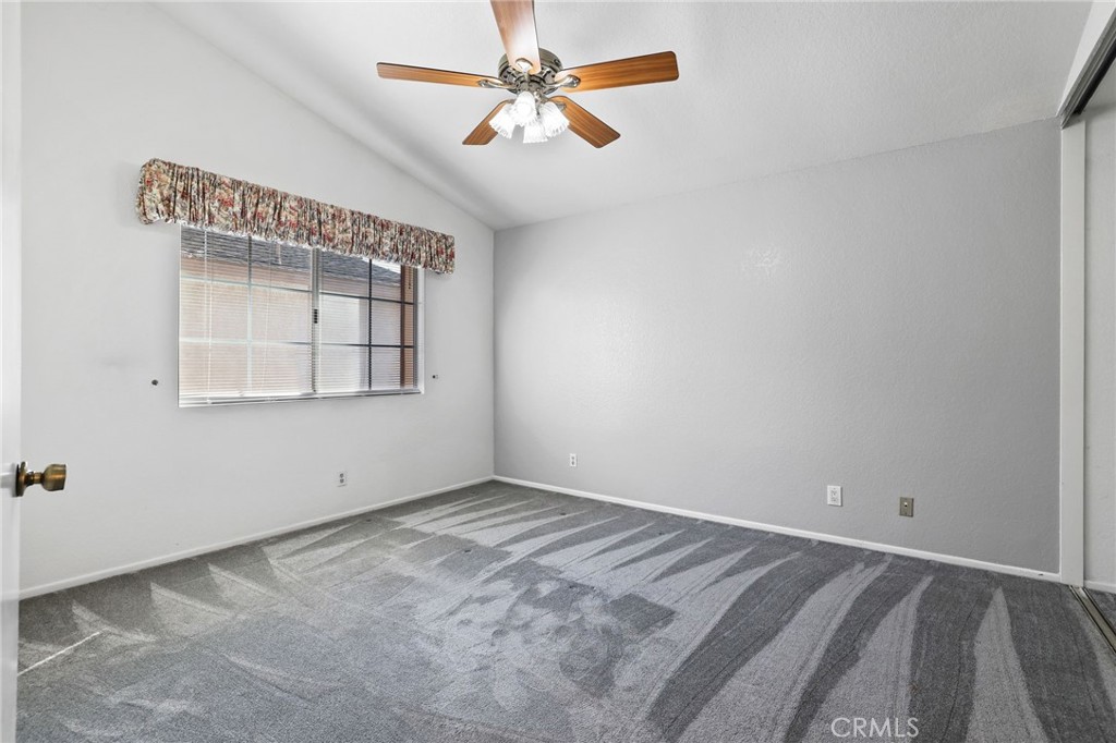 4 Gettysburg Irvine, CA 92620 - Photo 27 of 48 an empty room with windows and fan