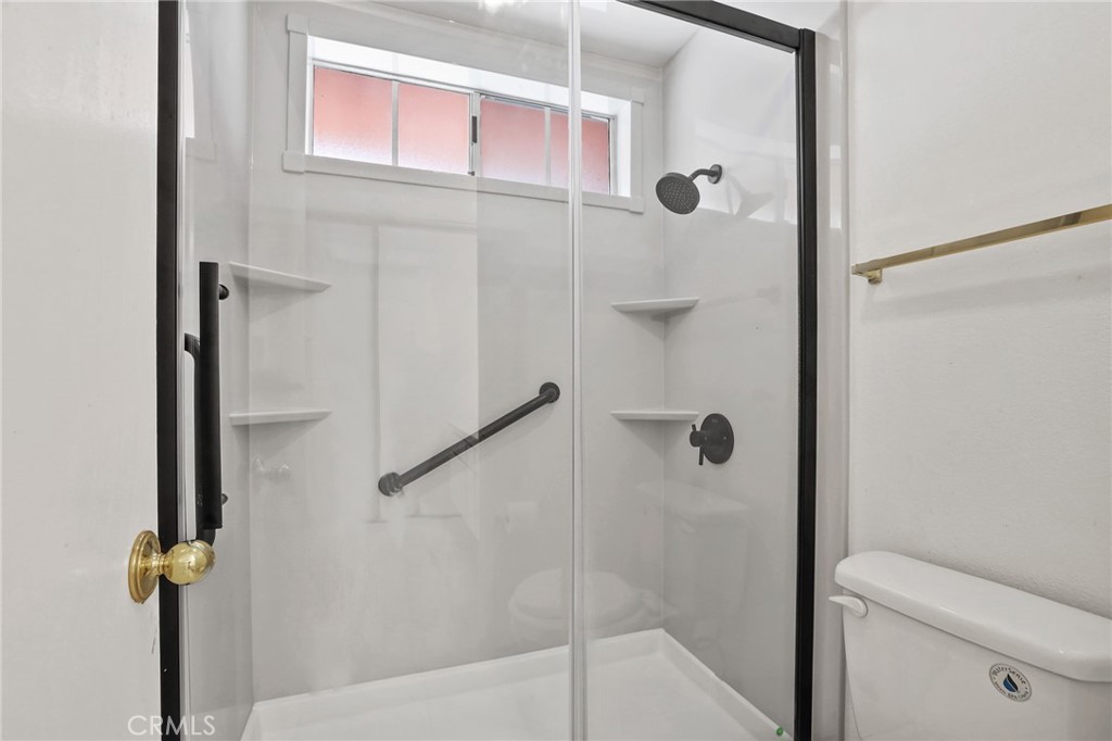 4 Gettysburg Irvine, CA 92620 - Photo 32 of 48 a bathroom with a shower