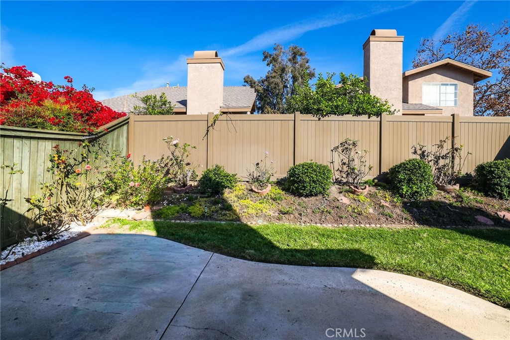 4 Gettysburg Irvine, CA 92620 - Photo 34 of 48 a front view of a house with a yard and fountain in middle