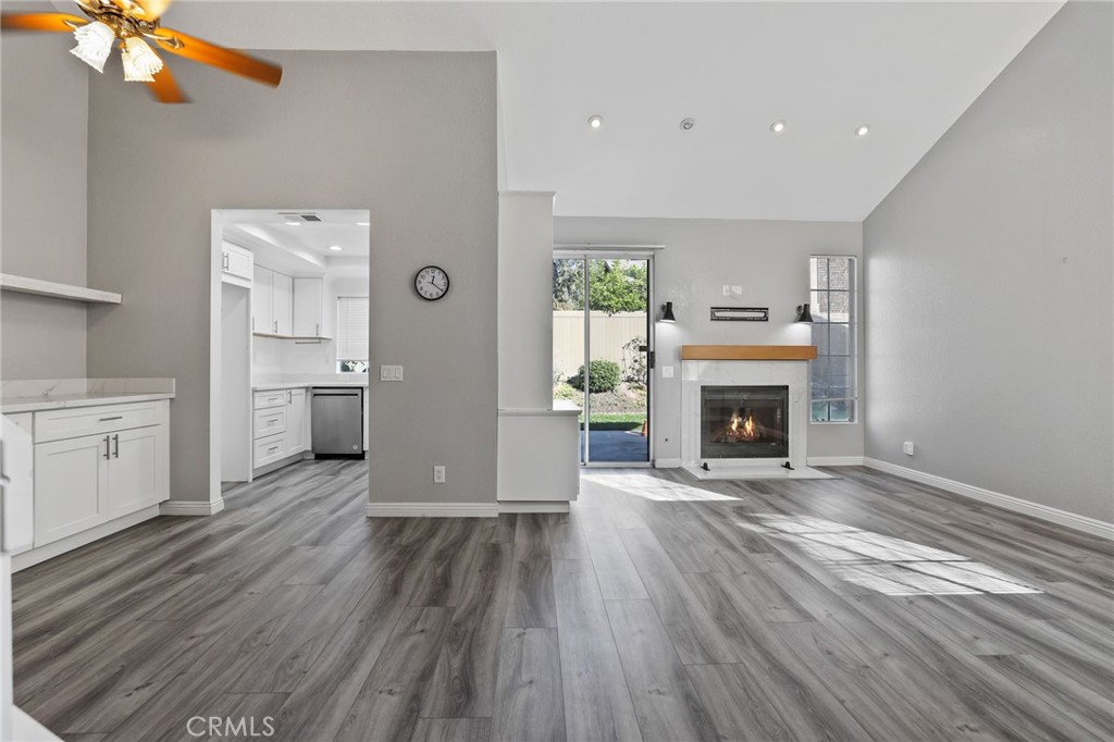 4 Gettysburg Irvine, CA 92620 - Photo 5 of 48 a view of kitchen and fireplace with wooden floor