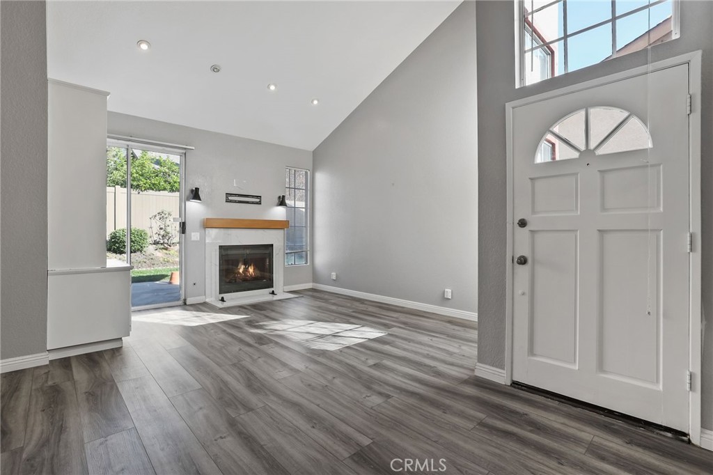 4 Gettysburg Irvine, CA 92620 - Photo 6 of 48 a view of an empty room with a fireplace and a window