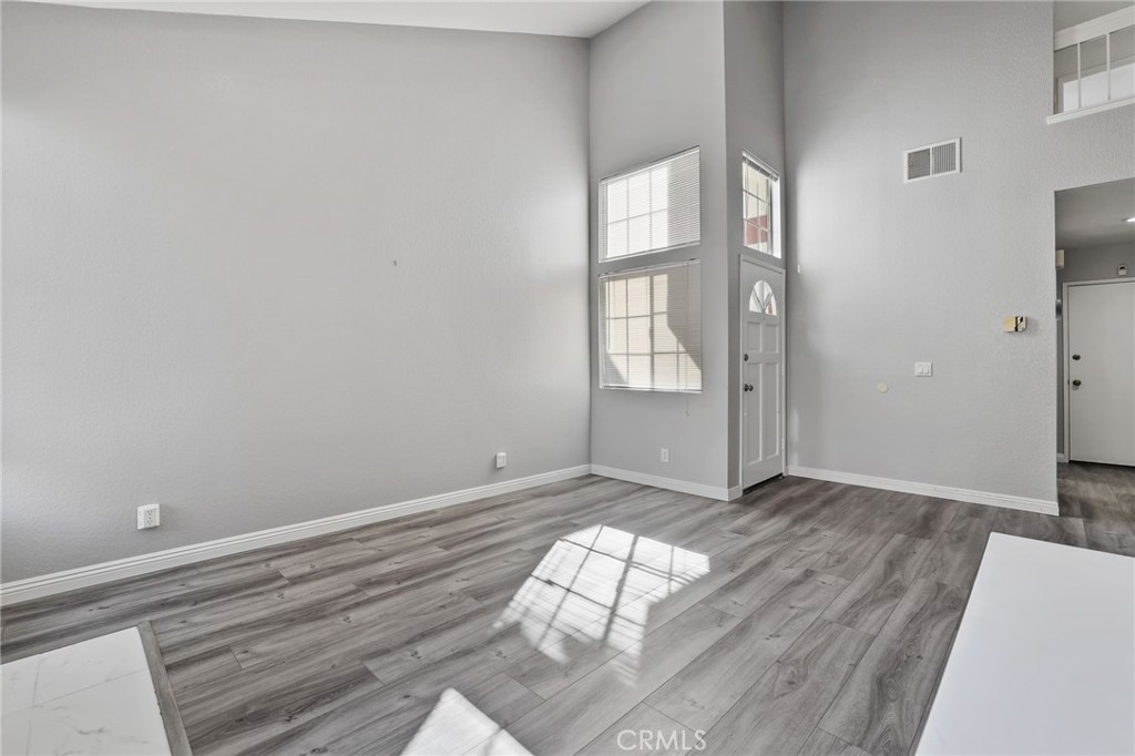 4 Gettysburg Irvine, CA 92620 - Photo 9 of 48 a view of empty room with wooden floor and fan