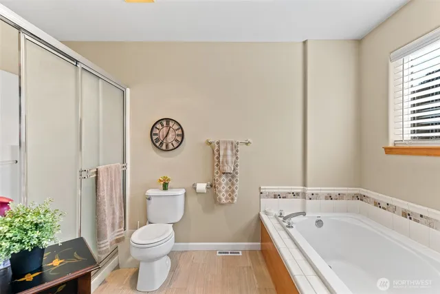 a bathroom with a sink a toilet and a tub