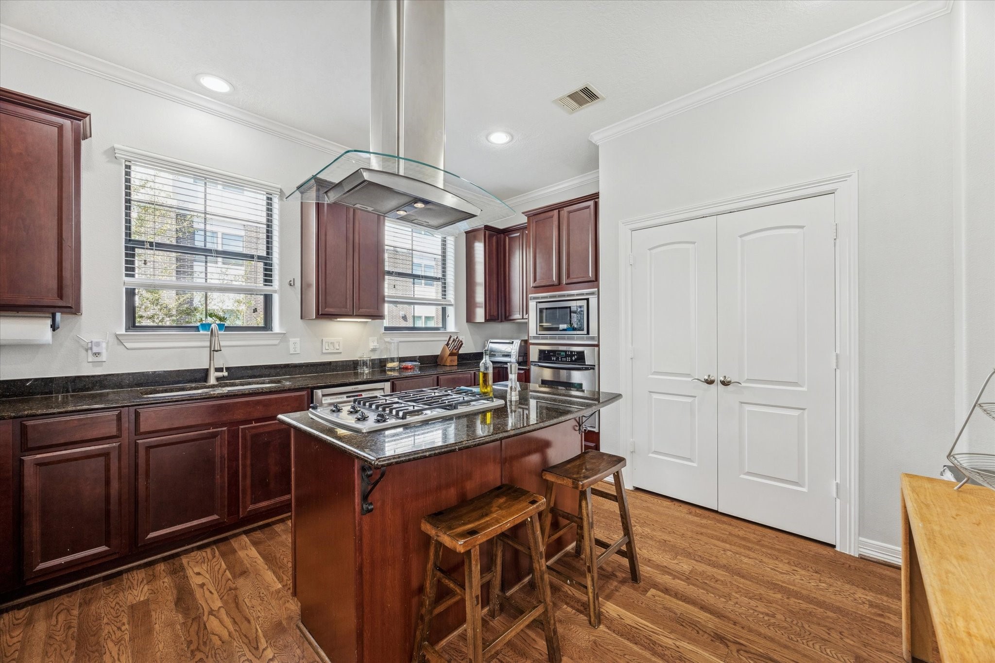 3203 Garden Oaks View Houston, TX 77018 - Photo 6 of 13 a kitchen with stainless steel appliances granite countertop a stove and a sink