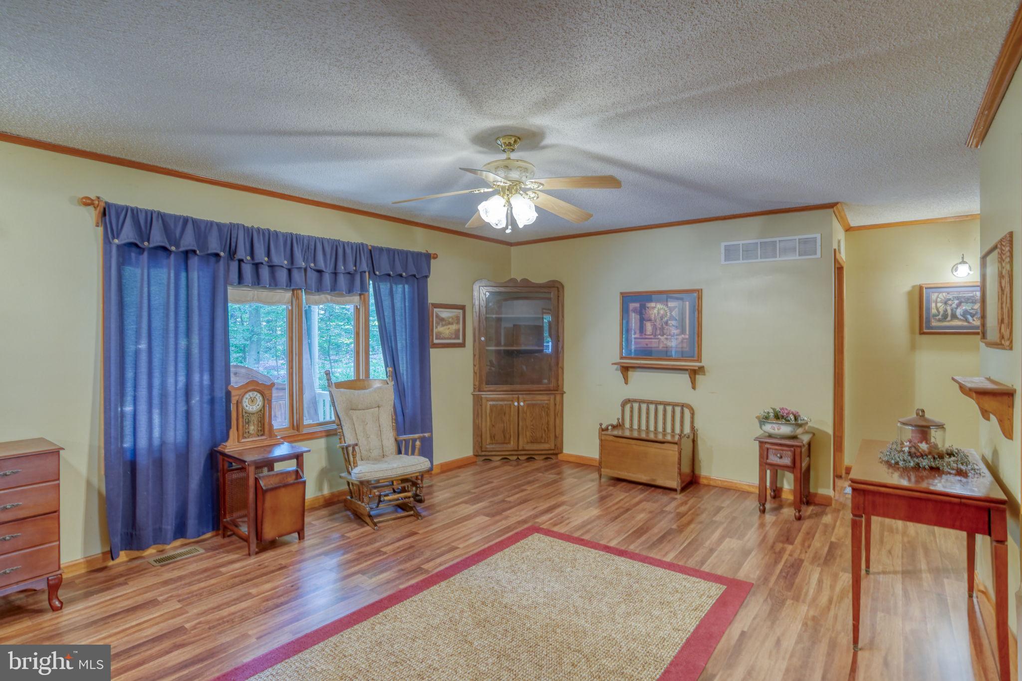 1332 Alley Mill Road Clayton, DE 19938 - Photo 15 of 50 a living room with furniture and a wooden floor