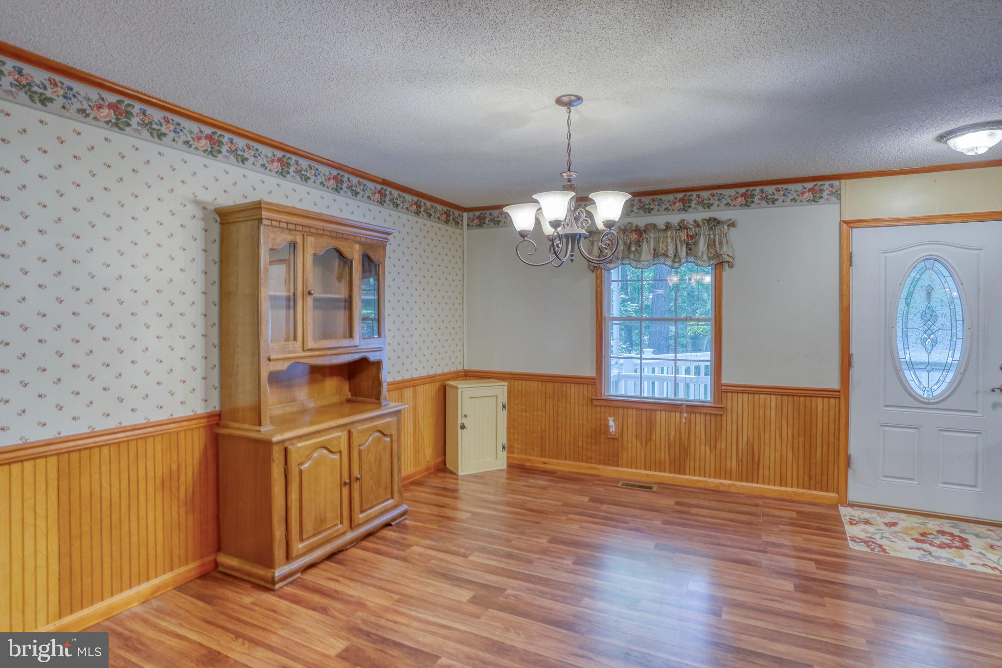 1332 Alley Mill Road Clayton, DE 19938 - Photo 20 of 50 a view of a room with wooden floor window and fireplace