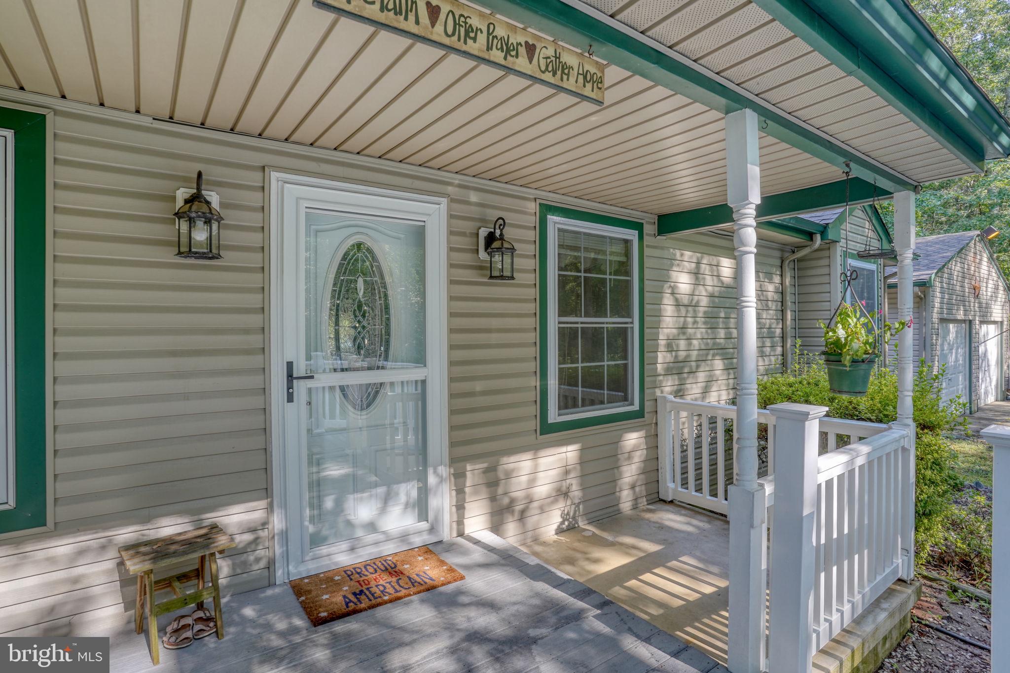 1332 Alley Mill Road Clayton, DE 19938 - Photo 3 of 50 a front view of a house with a porch