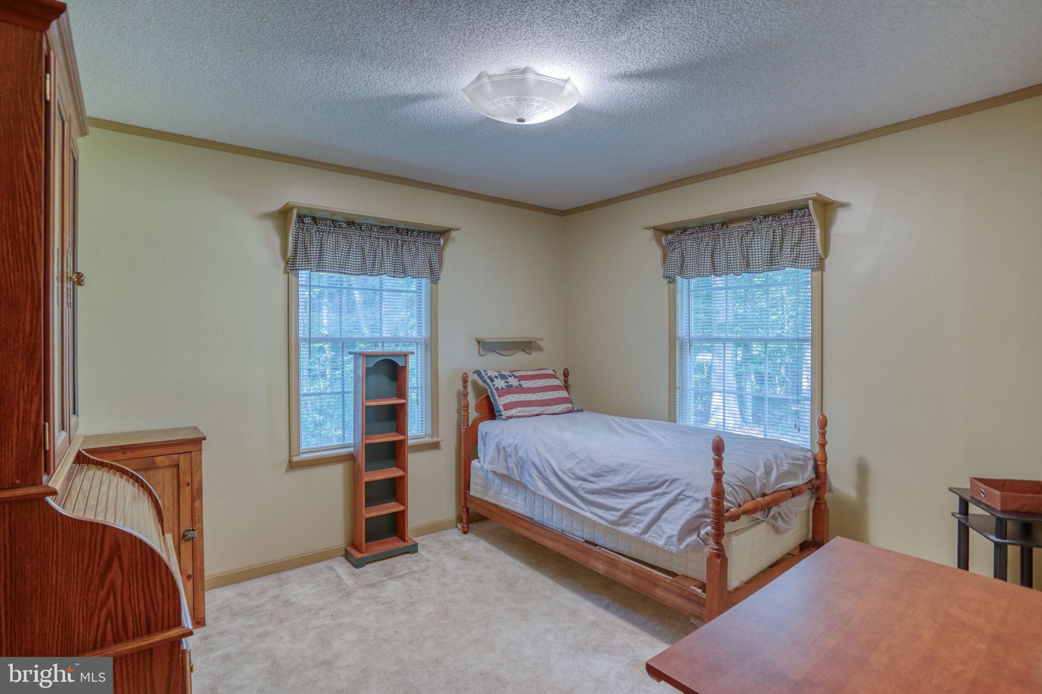 1332 Alley Mill Road Clayton, DE 19938 - Photo 34 of 50 a bedroom with a bed and a window