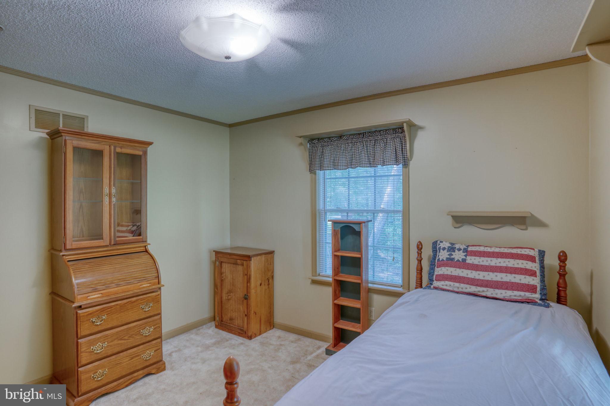 1332 Alley Mill Road Clayton, DE 19938 - Photo 35 of 50 a bedroom with furniture and a window