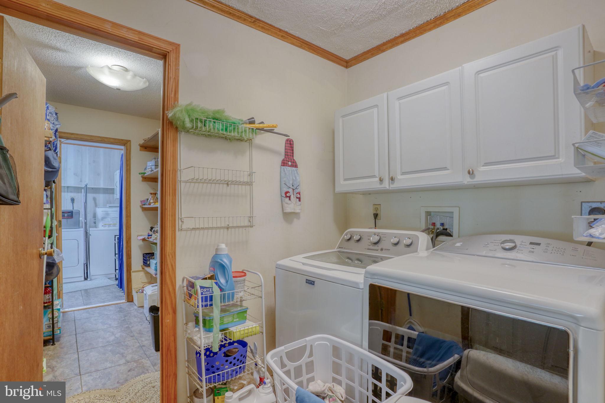 1332 Alley Mill Road Clayton, DE 19938 - Photo 37 of 50 a utility room with stainless steel appliances a stove a chimney a sink and cabinets