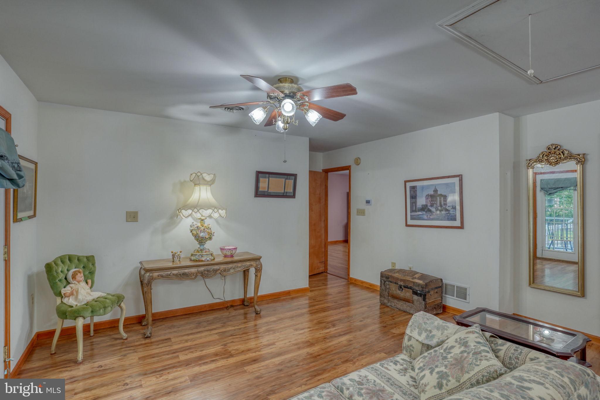 1332 Alley Mill Road Clayton, DE 19938 - Photo 39 of 50 a living room with furniture and wooden floor