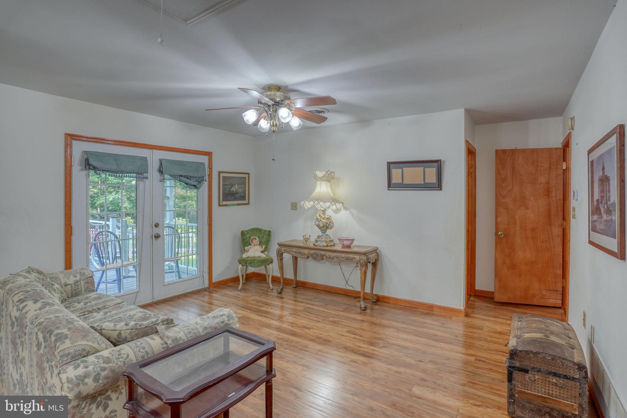 1332 Alley Mill Road Clayton, DE 19938 - Photo 40 of 50 a living room with furniture a window and a table