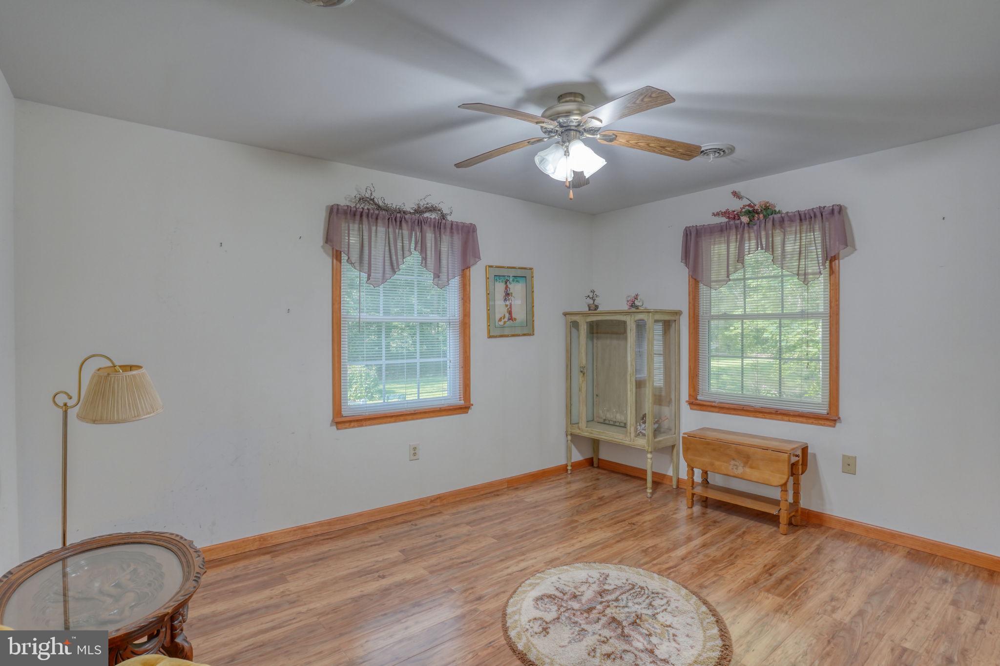 1332 Alley Mill Road Clayton, DE 19938 - Photo 44 of 50 a bedroom with a bed and a chandelier