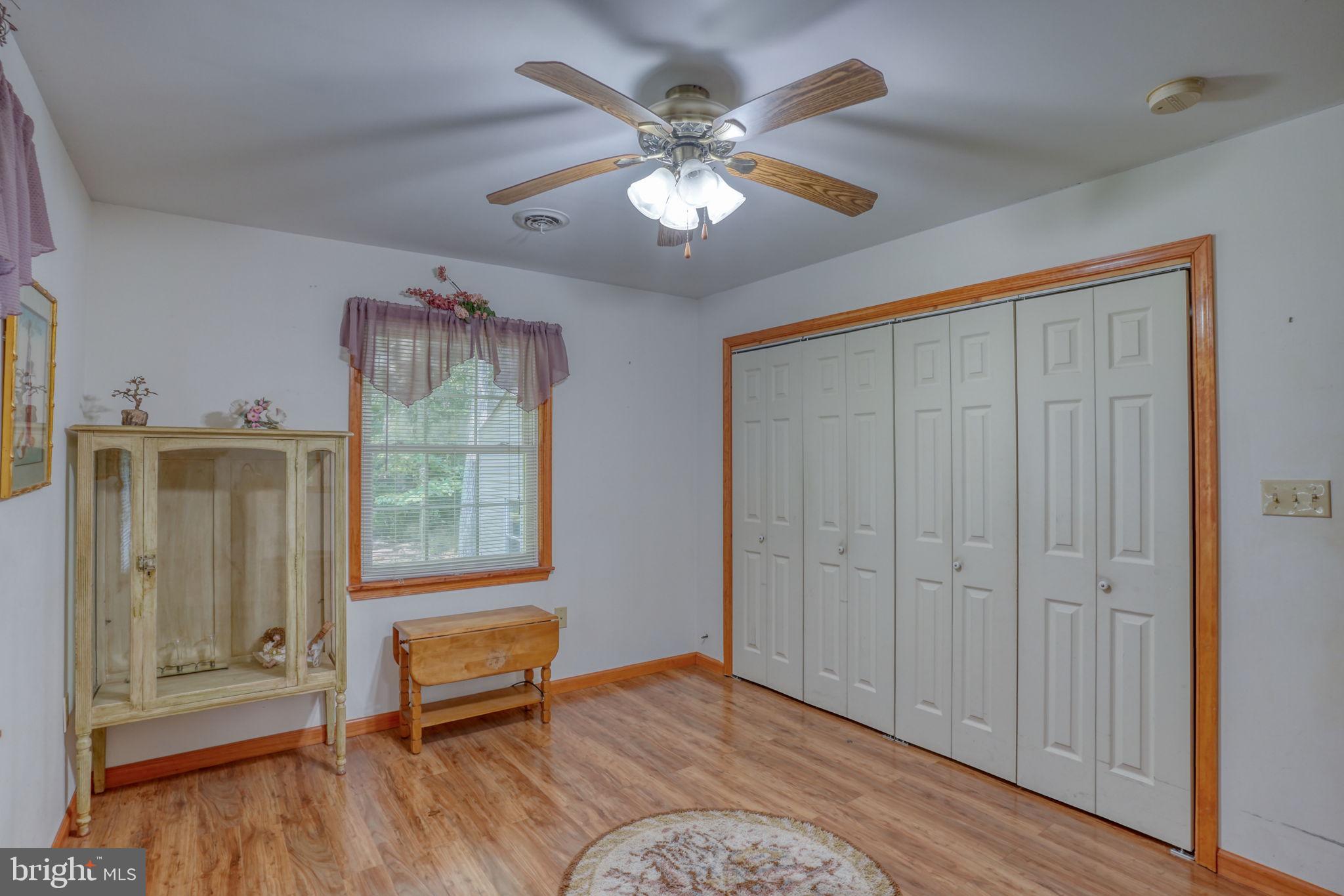 1332 Alley Mill Road Clayton, DE 19938 - Photo 45 of 50 a living room with furniture and a chandelier