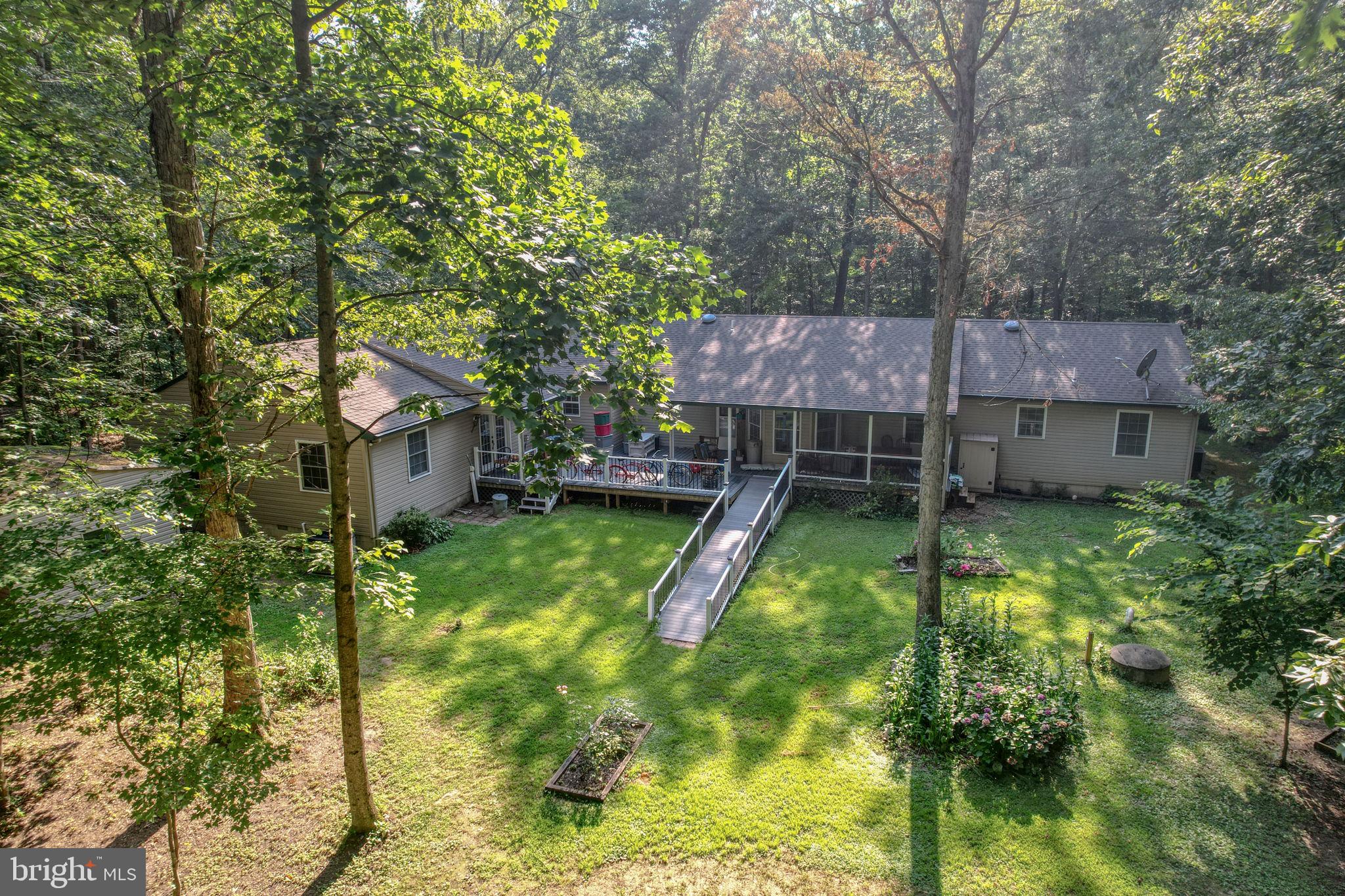 1332 Alley Mill Road Clayton, DE 19938 - Photo 8 of 50 a view of a backyard with a small cabin