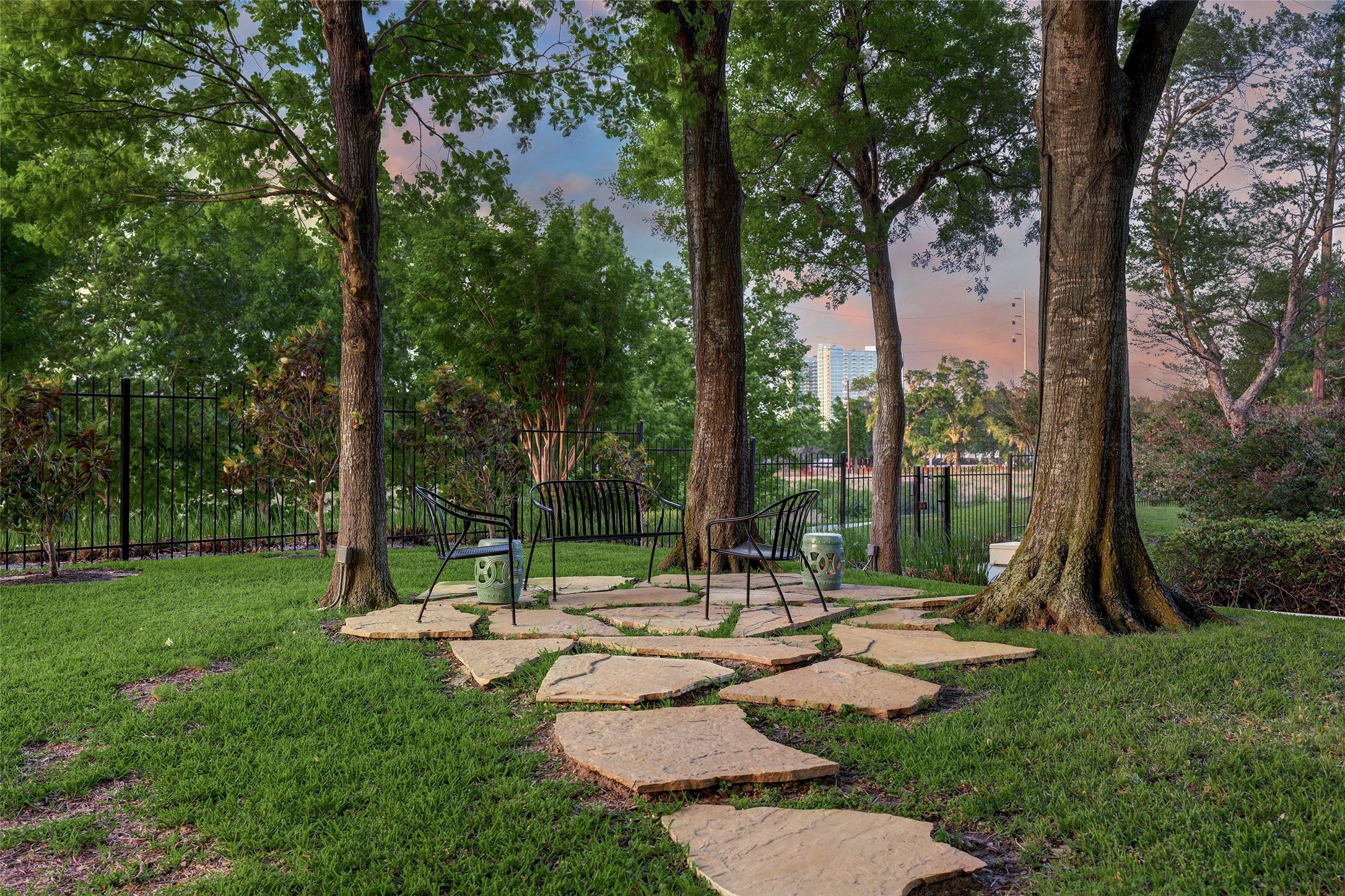 2001 Holcombe Boulevard, Unit 1801 Houston, TX 77030 - Photo 40 of 47 a view of a patio with a table chairs and a small yard