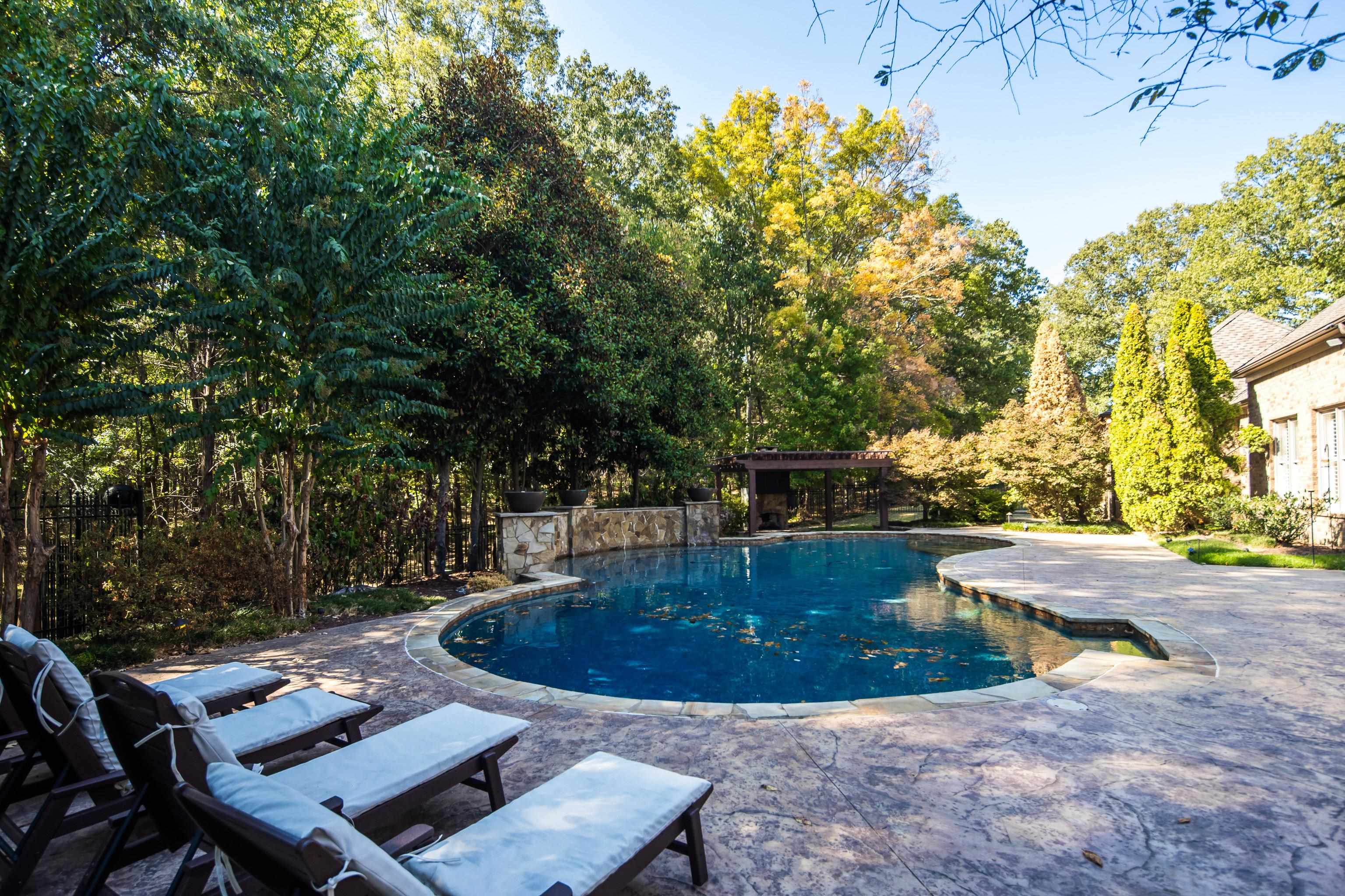425 Buckland Cove Eads, TN 38028 - Photo 25 of 29 Outdoor pool with a patio area and view of wooded area