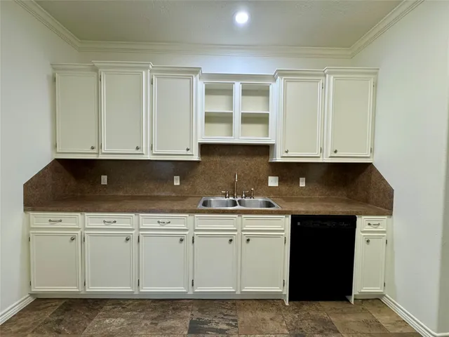 a kitchen with stainless steel appliances granite countertop a sink and cabinets