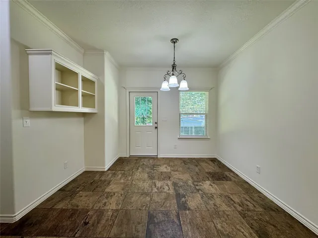 a view of empty room with windows