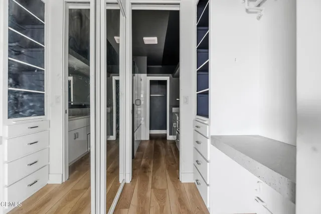 a bathroom with a granite countertop sink mirror and shower