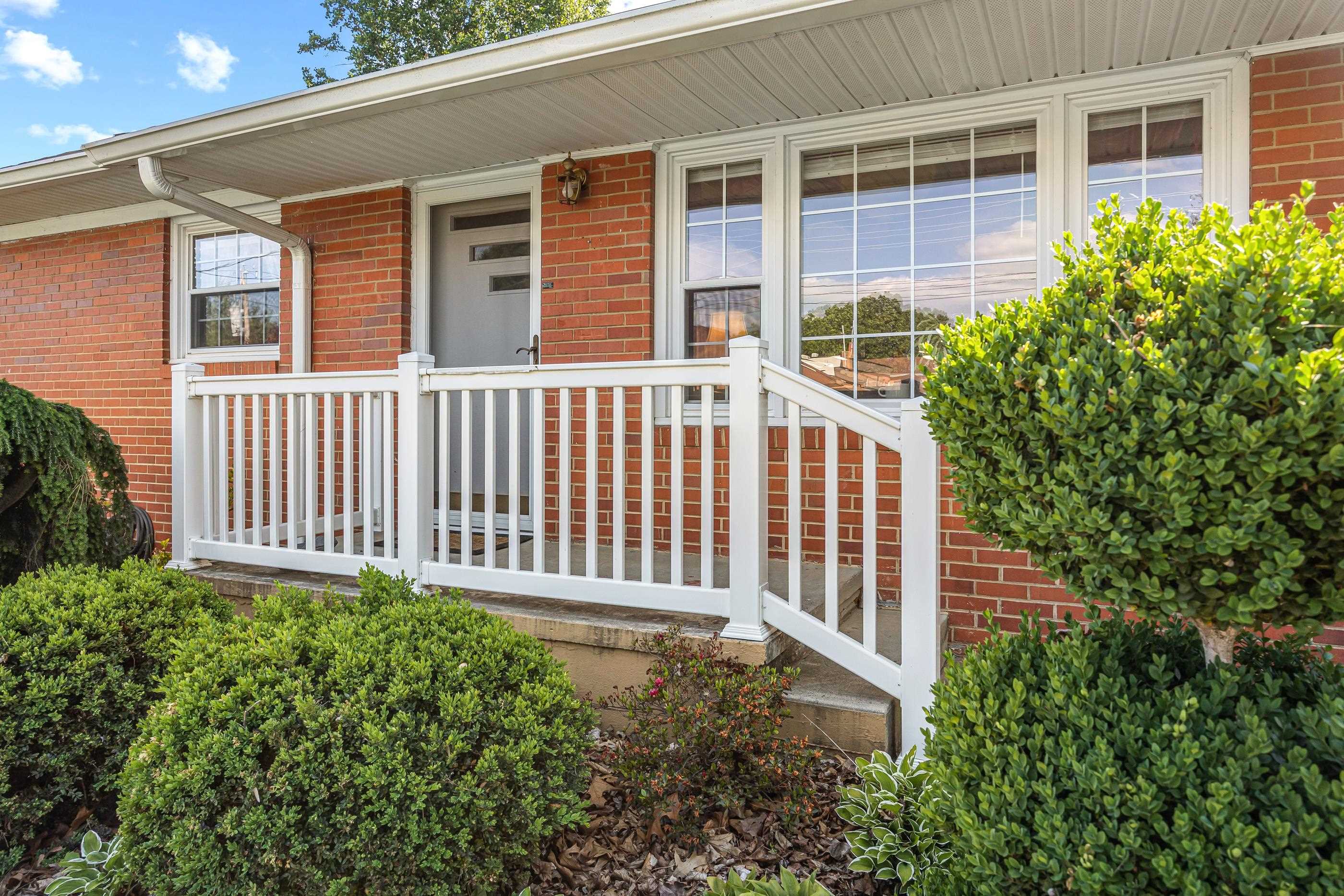 208 Tuxedo Road Staunton, VA 24401 - Photo 5 of 46 a front view of a house with a garden