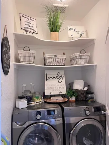 a view of washer and dryer in a shelf