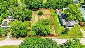 an aerial view of residential houses with yard