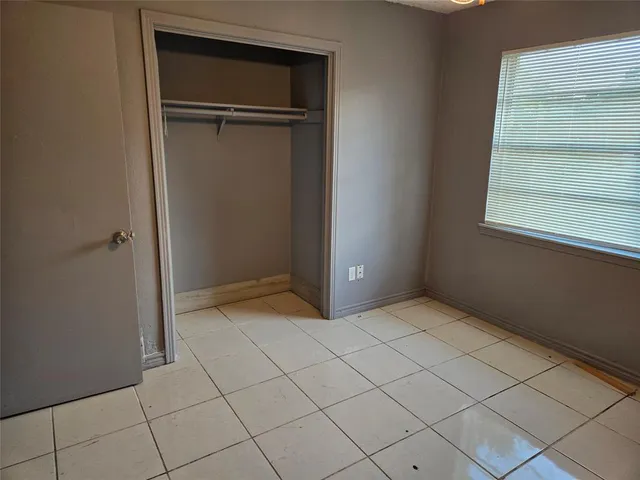 an empty room with cabinet