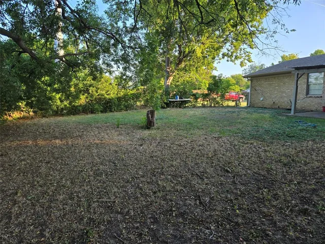 a view of a backyard with garden
