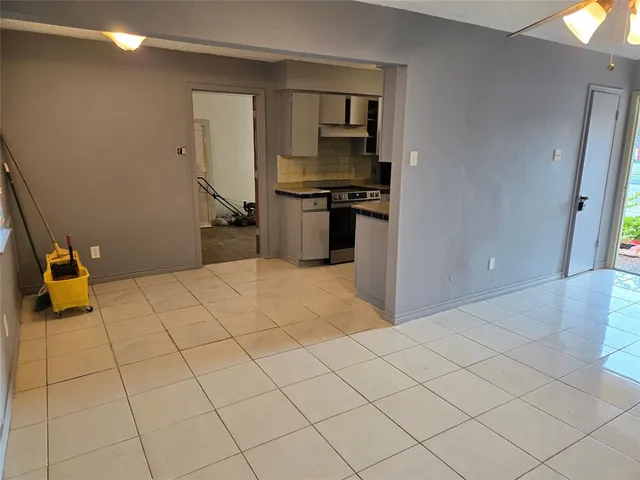 a bedroom with a bed and a mirror