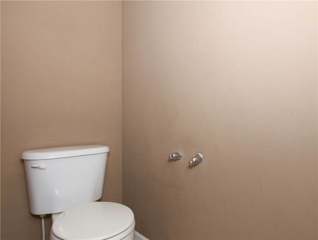 305 North Chestnut Street Seneca, SC 29678 - Photo 27 of 44 A quiet powder room features a classic white commode and neutral walls.