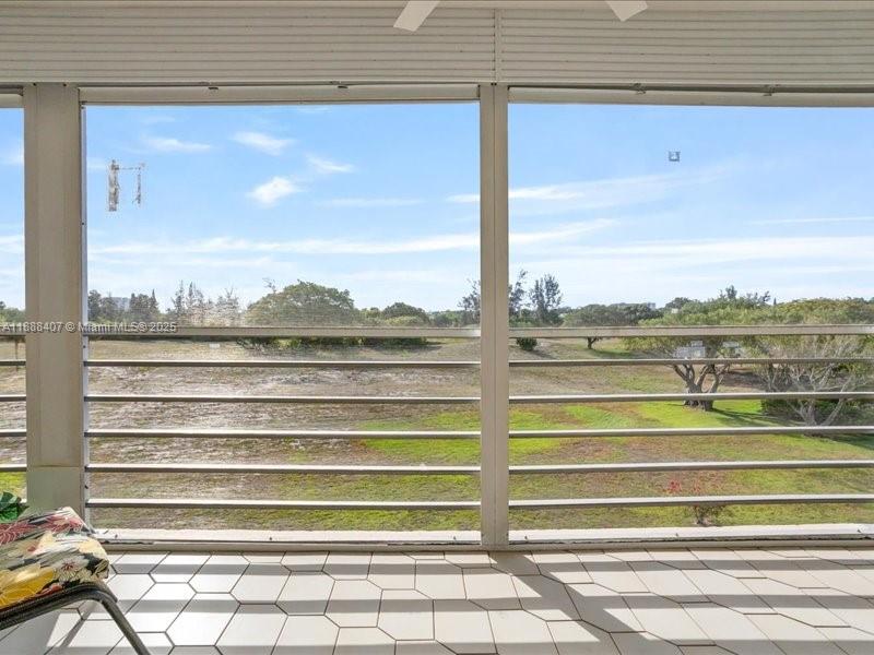 6200 Northwest 2nd Avenue, Unit 418 Boca Raton, FL 33487 - Photo 13 of 41 a view of a balcony with chairs and a table