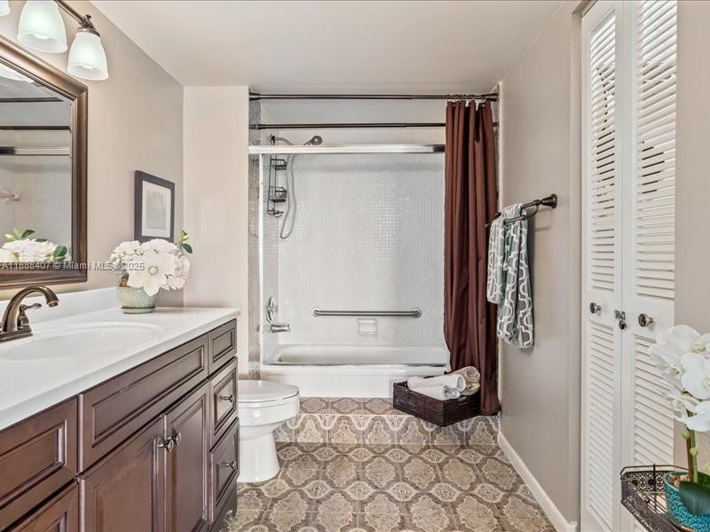 6200 Northwest 2nd Avenue, Unit 418 Boca Raton, FL 33487 - Photo 16 of 41 a bathroom with a granite countertop sink and a mirror