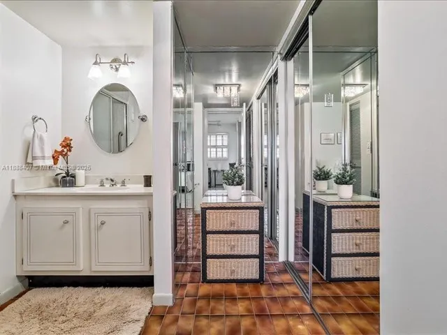 a bathroom with a sink double vanity and a mirror
