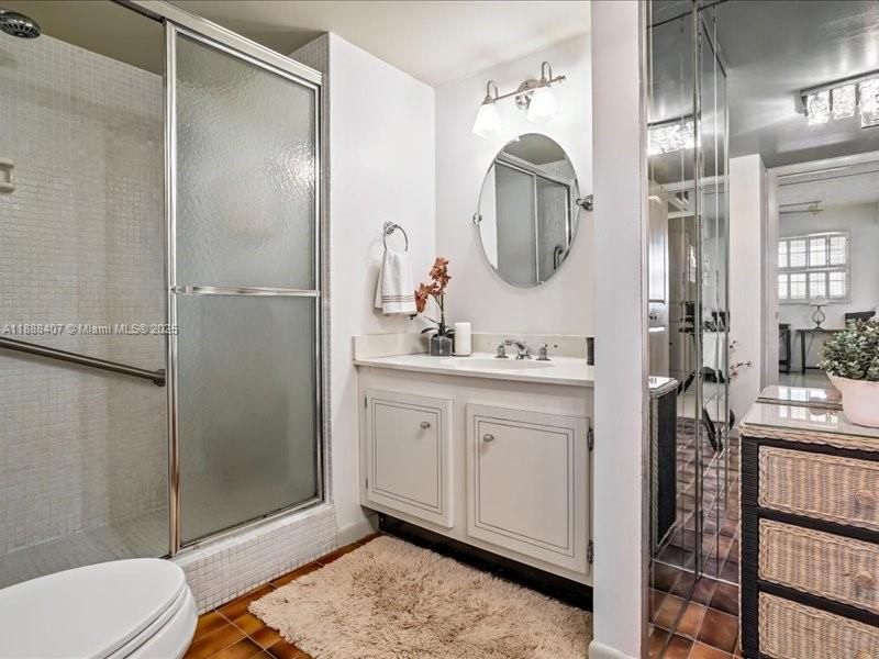 6200 Northwest 2nd Avenue, Unit 418 Boca Raton, FL 33487 - Photo 21 of 41 a spacious bathroom with a double vanity sink mirror and toilet