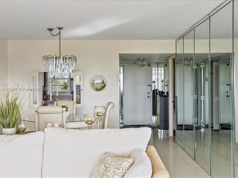 6200 Northwest 2nd Avenue, Unit 418 Boca Raton, FL 33487 - Photo 27 of 41 a dining room with furniture a chandelier and window